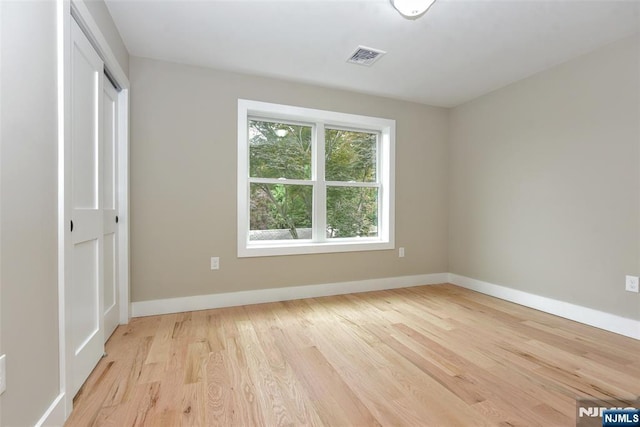 14 Charles Ter, Waldwick, NJ 07463 - unfurnished bedroom with light wood-style floors, baseboards, and a closet