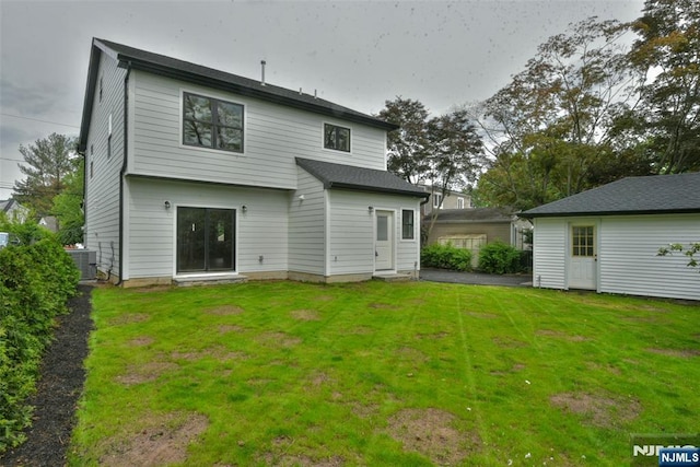 14 Charles Ter, Waldwick, NJ 07463 - rear view of house with central air condition unit and a lawn