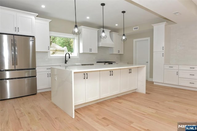 14 Charles Ter, Waldwick, NJ 07463 - kitchen with freestanding refrigerator, custom exhaust hood, a sink, light wood-type flooring, and recessed lighting