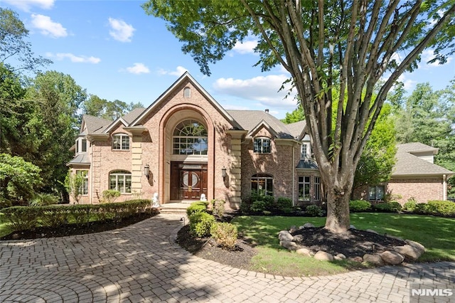 14 Stewart Ct, Old Tappan, NJ 07675 - view of front of home featuring a front yard and brick siding