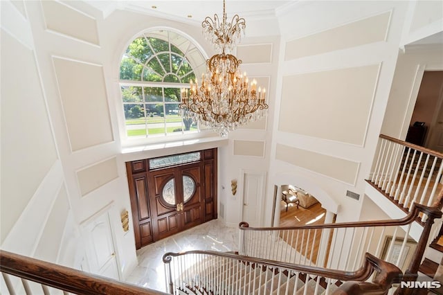 14 Stewart Ct, Old Tappan, NJ 07675 - entrance foyer with a chandelier, a towering ceiling, light marble finish flooring, ornamental molding, and stairway