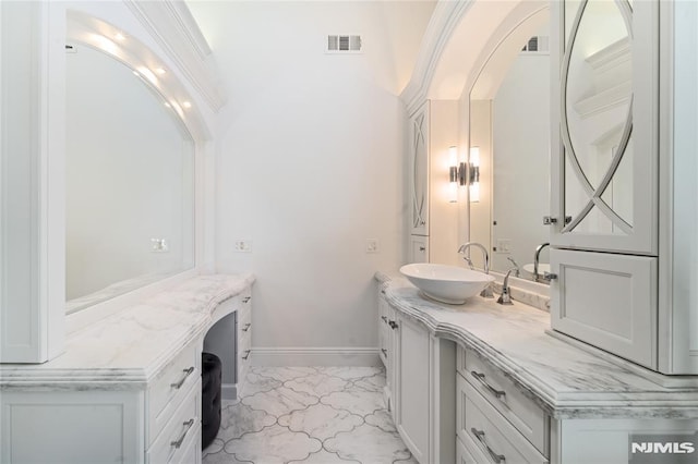 14 Stewart Ct, Old Tappan, NJ 07675 - bathroom featuring marble look tiles, vanity, and baseboards