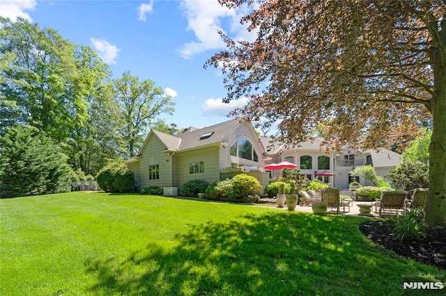 14 Stewart Ct, Old Tappan, NJ 07675 - view of green lawn with a patio area
