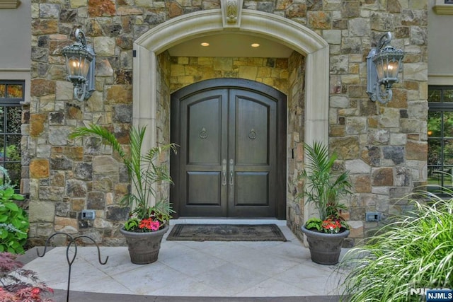 70 Oak Dr, Upper Saddle River, NJ 07458 - doorway to property featuring stone siding