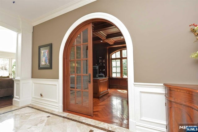 70 Oak Dr, Upper Saddle River, NJ 07458 - unfurnished dining area featuring ornamental molding, a decorative wall, a wainscoted wall, french doors, and beam ceiling