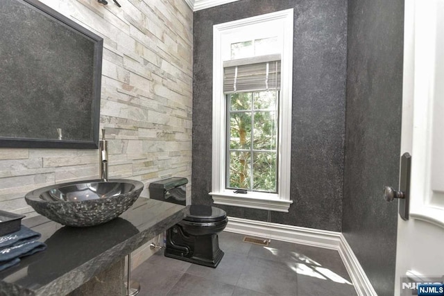 70 Oak Dr, Upper Saddle River, NJ 07458 - half bathroom featuring tile patterned flooring, toilet, a sink, and baseboards