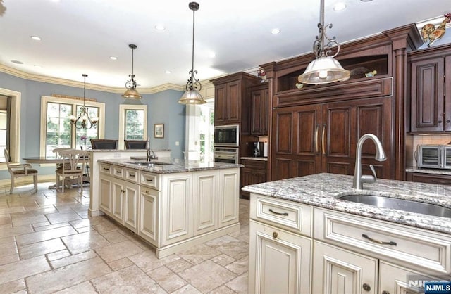 70 Oak Dr, Upper Saddle River, NJ 07458 - kitchen with a sink, cream cabinets, appliances with stainless steel finishes, stone tile floors, and recessed lighting
