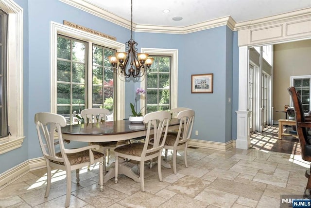 70 Oak Dr, Upper Saddle River, NJ 07458 - dining space with a chandelier, stone tile flooring, baseboards, and ornamental molding