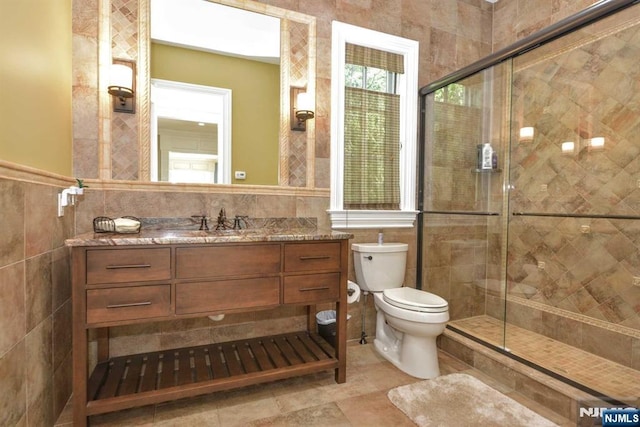 70 Oak Dr, Upper Saddle River, NJ 07458 - full bath with tile walls, vanity, a shower stall, toilet, and a wainscoted wall