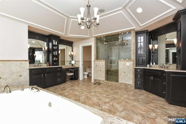 70 Oak Dr, Upper Saddle River, NJ 07458 - bathroom featuring a chandelier, a shower stall, a bidet, vanity, and tile walls