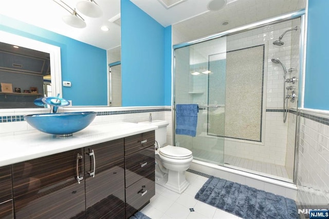 70 Oak Dr, Upper Saddle River, NJ 07458 - bathroom with tile walls, vanity, tile patterned floors, a shower stall, and toilet