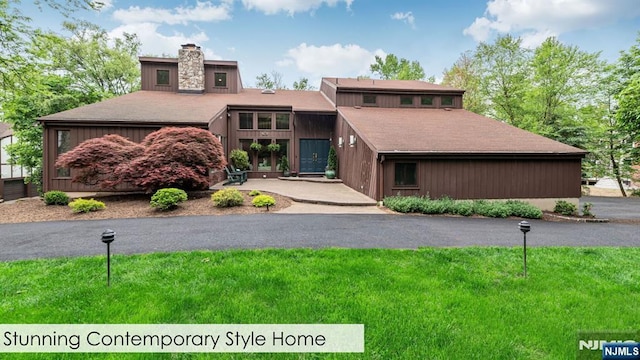 108 Buckhaven Hl, Upper Saddle River, NJ 07458 - view of front of property with a chimney, a front lawn, and roof with shingles