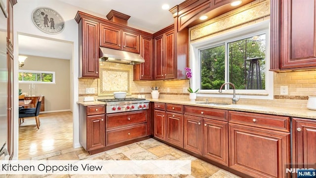 108 Buckhaven Hl, Upper Saddle River, NJ 07458 - kitchen featuring under cabinet range hood, dark brown cabinets, stainless steel gas stovetop, and a sink