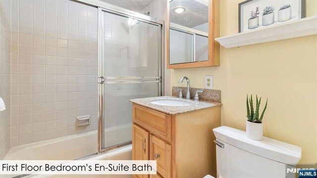 108 Buckhaven Hl, Upper Saddle River, NJ 07458 - full bathroom with combined bath / shower with glass door, toilet, and vanity