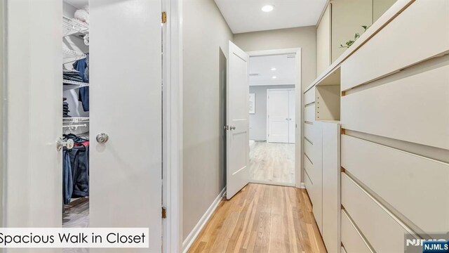 108 Buckhaven Hl, Upper Saddle River, NJ 07458 - hall with light wood-type flooring, recessed lighting, and baseboards