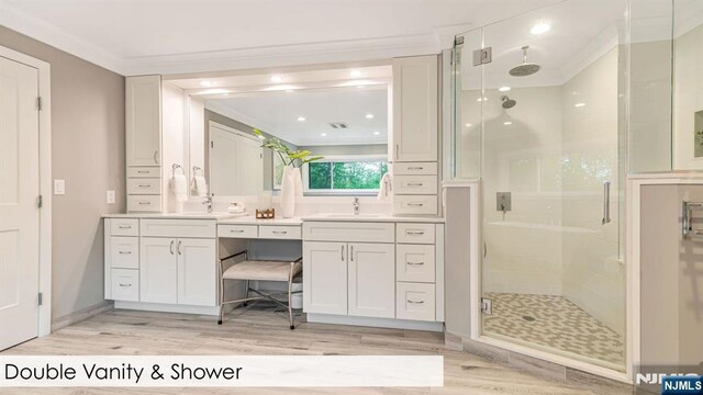 108 Buckhaven Hl, Upper Saddle River, NJ 07458 - bathroom featuring crown molding, a stall shower, wood finished floors, and vanity