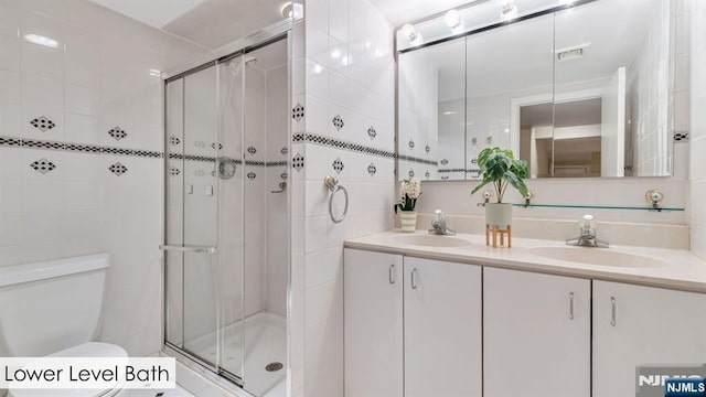 108 Buckhaven Hl, Upper Saddle River, NJ 07458 - full bath with tile walls, toilet, a shower stall, and double vanity