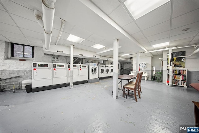 1055 Boulevard Blvd Unit D3, Weehawken, NJ 07086 - misc room featuring a paneled ceiling, washer and dryer, and concrete flooring