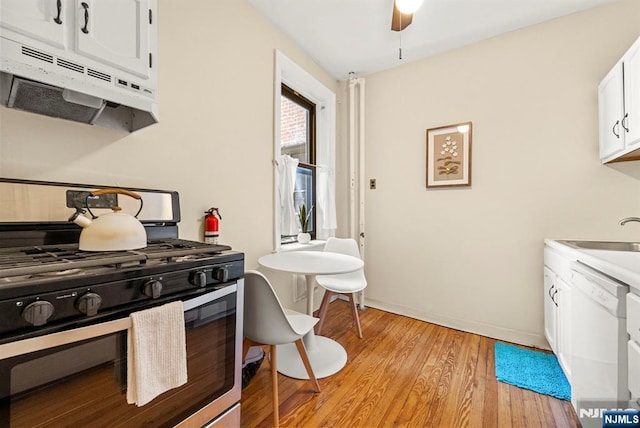 1055 Boulevard Blvd Unit D3, Weehawken, NJ 07086 - kitchen featuring gas range, under cabinet range hood, dishwasher, a sink, and light wood-type flooring