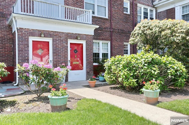 927 Commonwealth Dr Unit 4, Teaneck, NJ 07666 - doorway to property with a balcony and brick siding