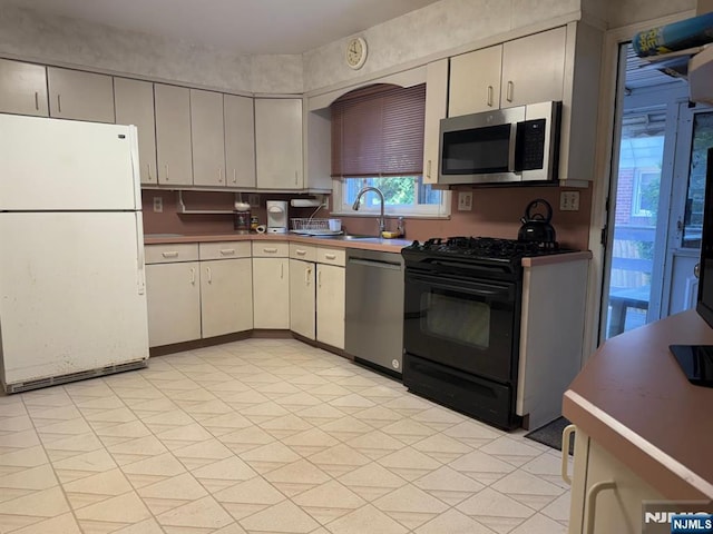 384 Audubon Rd, Englewood, NJ 07631 - kitchen featuring appliances with stainless steel finishes and a sink