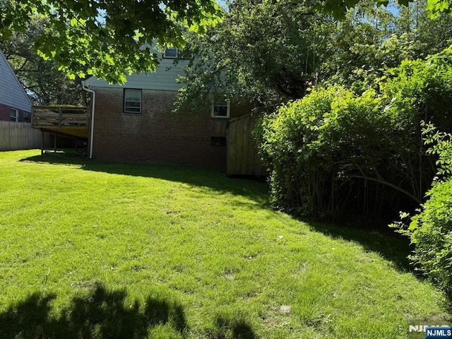 384 Audubon Rd, Englewood, NJ 07631 - view of grassy yard with a wooden deck