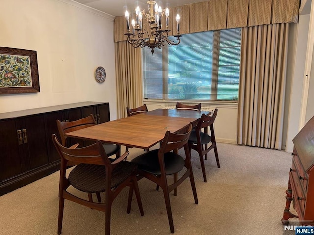 384 Audubon Rd, Englewood, NJ 07631 - dining space featuring a chandelier, light carpet, and crown molding