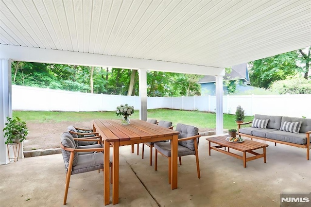 view of patio / terrace with outdoor lounge area, outdoor dining area, and a fenced backyard