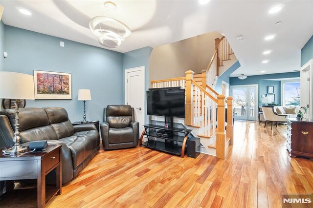 8709 Churchill Rd, North Bergen, NJ 07047 - living room with stairs, wood finished floors, and recessed lighting