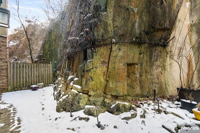 8709 Churchill Rd, North Bergen, NJ 07047 - yard covered in snow with fence