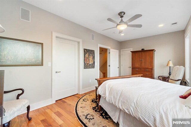 8709 Churchill Rd, North Bergen, NJ 07047 - bedroom with light wood-style floors, baseboards, recessed lighting, and ceiling fan