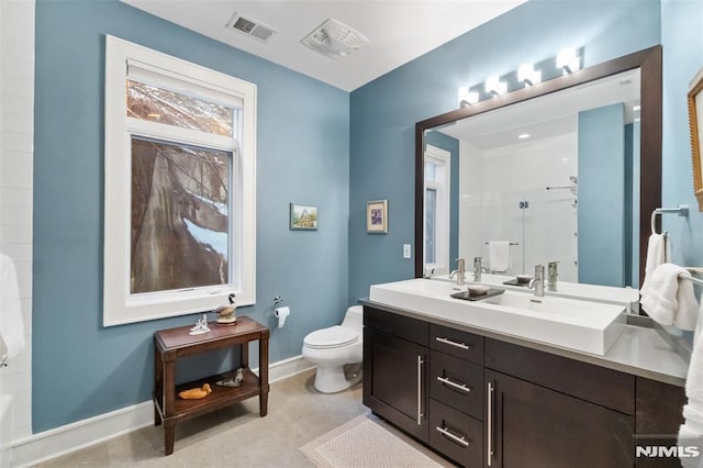 8709 Churchill Rd, North Bergen, NJ 07047 - full bath with toilet, a shower, baseboards, and double vanity