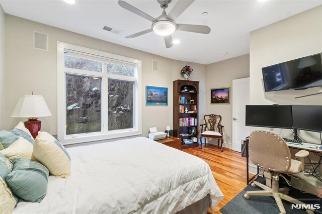 8709 Churchill Rd, North Bergen, NJ 07047 - bedroom featuring wood finished floors, recessed lighting, baseboards, a ceiling fan, and an office area
