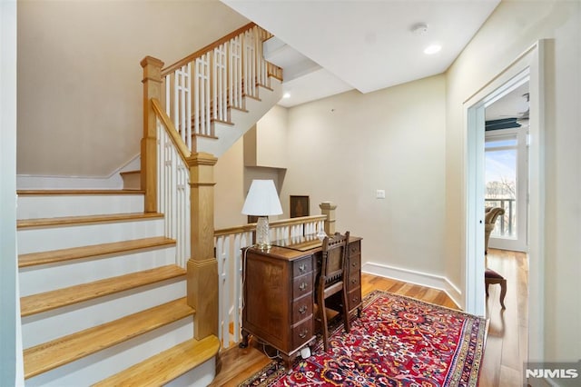 8709 Churchill Rd, North Bergen, NJ 07047 - stairs featuring wood finished floors and baseboards