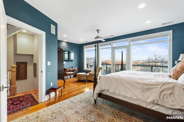 8709 Churchill Rd, North Bergen, NJ 07047 - bedroom with wood finished floors, access to outside, and recessed lighting