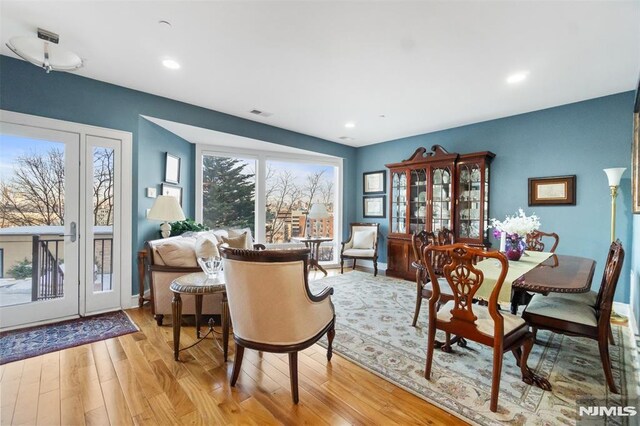 8709 Churchill Rd, North Bergen, NJ 07047 - dining room with light wood-type flooring, recessed lighting, and baseboards