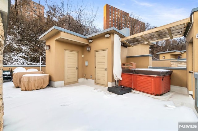 8709 Churchill Rd, North Bergen, NJ 07047 - exterior space featuring a hot tub, stucco siding, and a patio