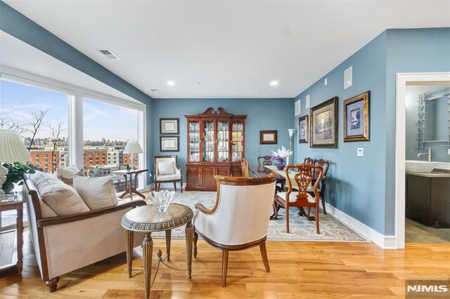 8709 Churchill Rd, North Bergen, NJ 07047 - living area featuring light wood finished floors, baseboards, and recessed lighting