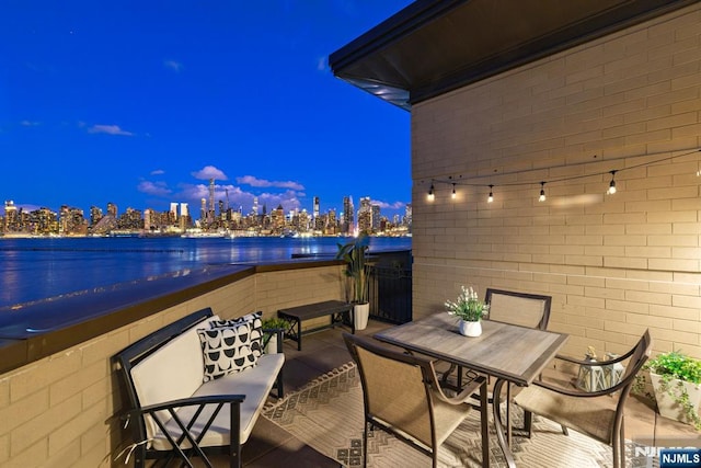 1 Oxford Lndg Unit 1, Weehawken, NJ 07086 - balcony at night featuring a view of city lights