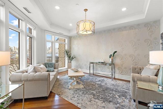 1 Oxford Lndg Unit 1, Weehawken, NJ 07086 - living area with a raised ceiling, wood finished floors, plenty of natural light, recessed lighting, and wallpapered walls