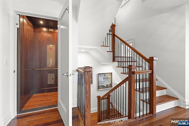 1 Oxford Lndg Unit 1, Weehawken, NJ 07086 - staircase with wood finished floors, elevator, and baseboards