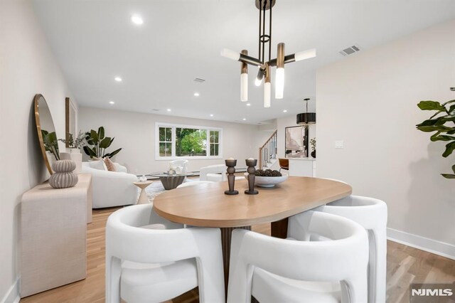 246 Oakwood Dr, Paramus, NJ 07652 - dining area with stairway, light wood-type flooring, baseboards, and recessed lighting