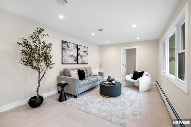 246 Oakwood Dr, Paramus, NJ 07652 - living room featuring a baseboard radiator, recessed lighting, and baseboards