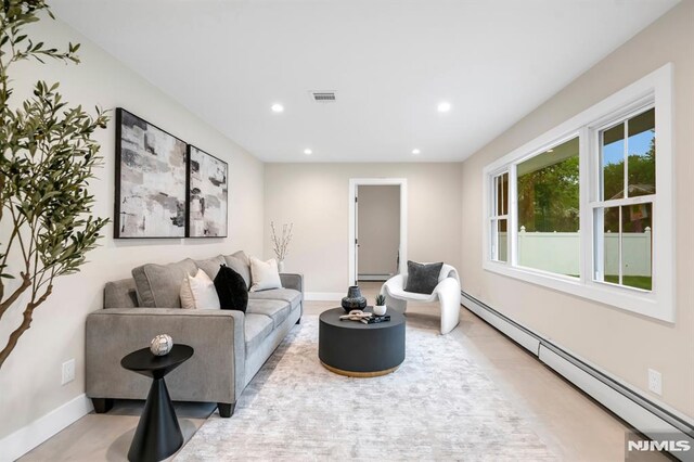 246 Oakwood Dr, Paramus, NJ 07652 - living room with a baseboard radiator, recessed lighting, and baseboards