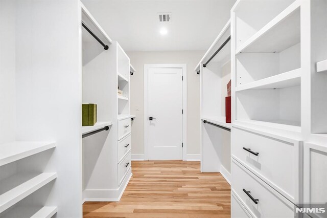 246 Oakwood Dr, Paramus, NJ 07652 - walk in closet featuring light wood-type flooring