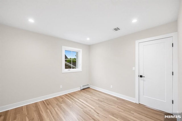 246 Oakwood Dr, Paramus, NJ 07652 - spare room featuring baseboard heating, light wood finished floors, baseboards, and recessed lighting