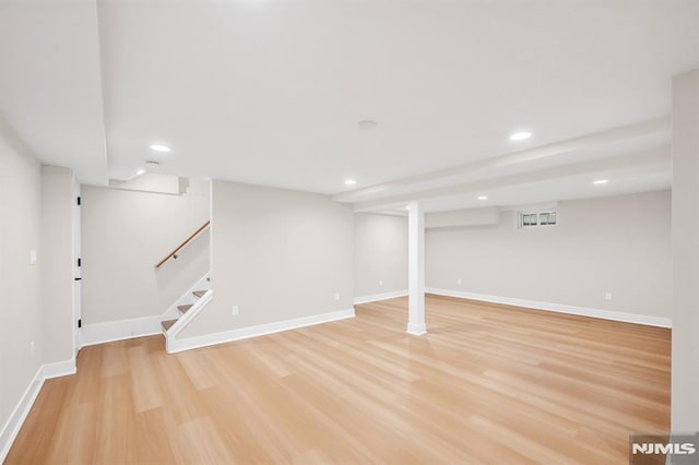 246 Oakwood Dr, Paramus, NJ 07652 - finished basement featuring light wood-type flooring, recessed lighting, stairway, and baseboards