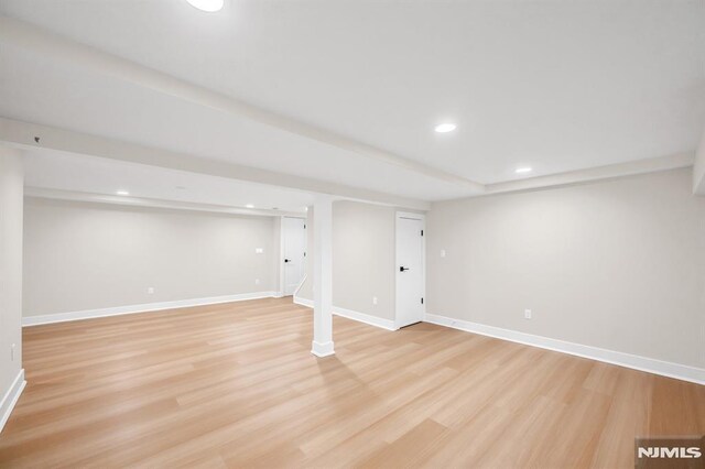 246 Oakwood Dr, Paramus, NJ 07652 - finished below grade area with light wood-type flooring, recessed lighting, and baseboards