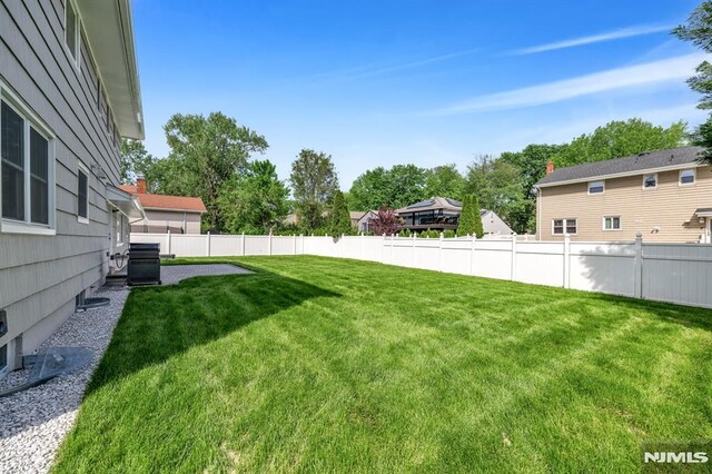 246 Oakwood Dr, Paramus, NJ 07652 - view of yard featuring central air condition unit