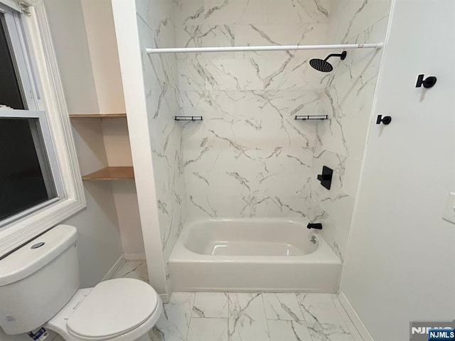 257 New St, Orange, NJ 07050 - bathroom featuring toilet, tub / shower combination, marble look tile flooring, and baseboards